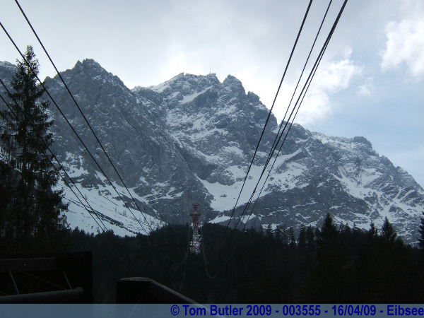 Photo ID: 003555, Looking up to the Zugspitze from the base of the Eibsee Cable car, Eibsee, Germany