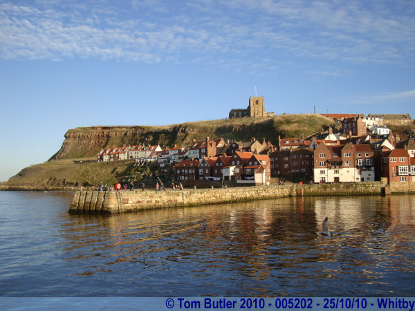 Photo ID: 005202, Looking up to St Mary's Church and the Abbey from the Harbour wall, Whitby, England
