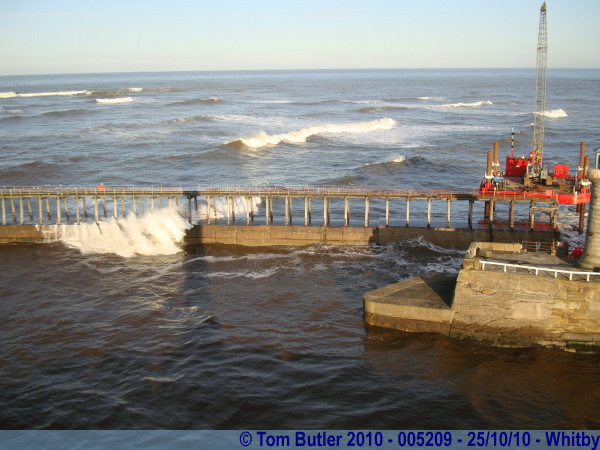 Photo ID: 005209, The rough sea crashes over the harbour walls, Whitby, England
