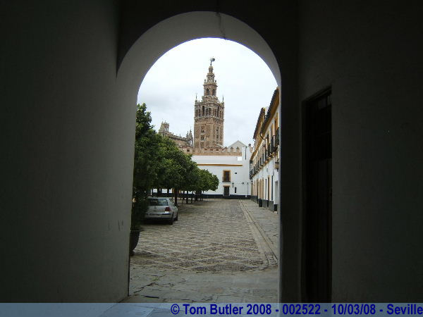 Photo ID: 002522, The Giralda from a passageway in the Real Alczar, Seville, Spain