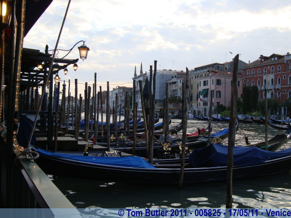 Photo ID: 005825, Gondoliers Moored up near Rialto, Venice, Italy