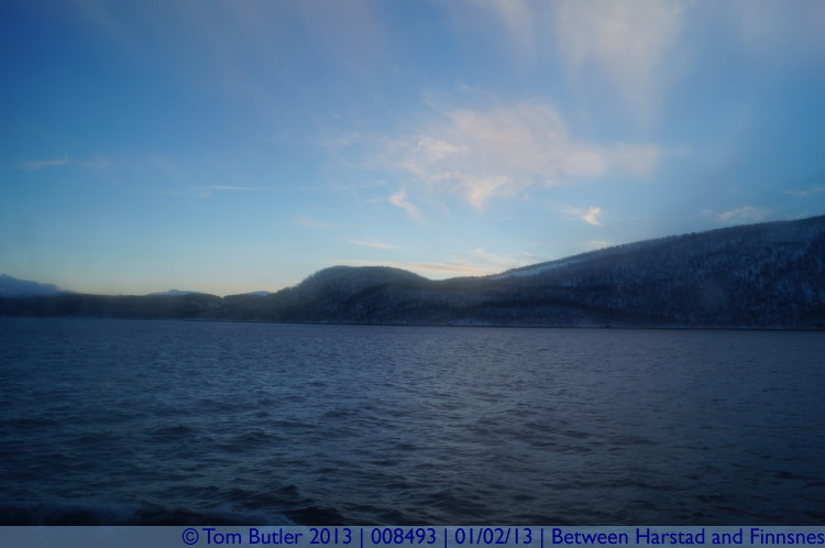 Photo ID: 008493, The sun starts to rise into a clear sky, On the Hurtigruten between Harstad and Finnsnes, Norway