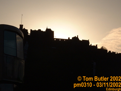 Photo ID: pm0310, Autumn sun setting behind the ramparts of Edinburgh castle from Waverly Bridge, Edinburgh, Scotland