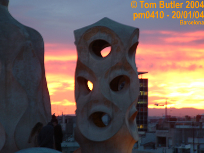 Photo ID: pm0410, The sun setting behind the strange sculptures on the Casa Mila, Barcelona, Spain
